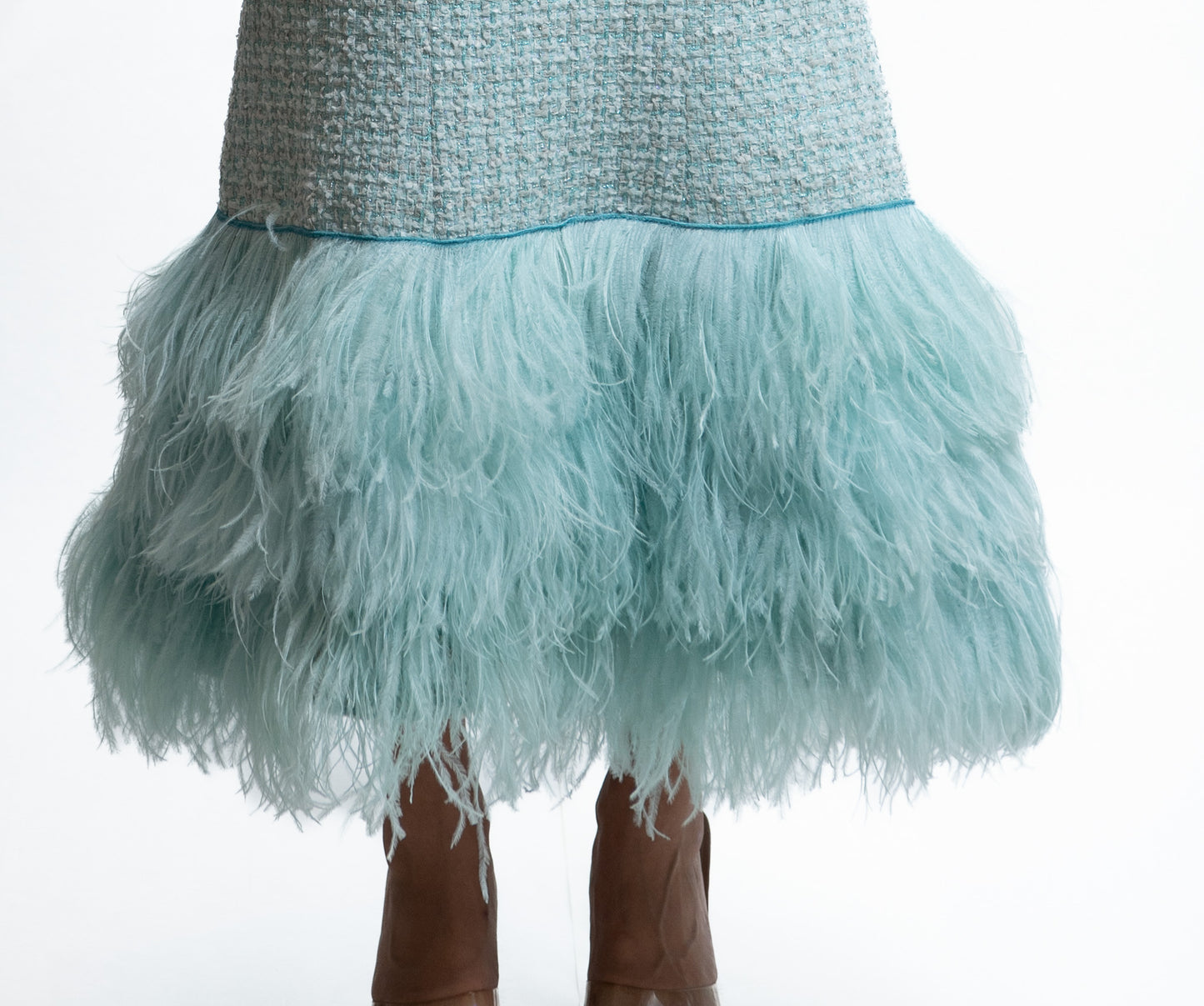 Evening gown in aqua tweed with feathered hem